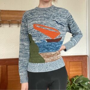 Vintage sweater of sailing boat, water and bird